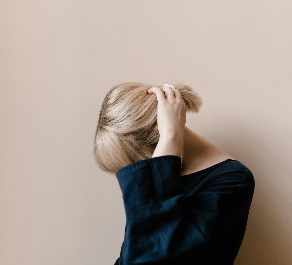 Woman being shy after feeling undervalued at work